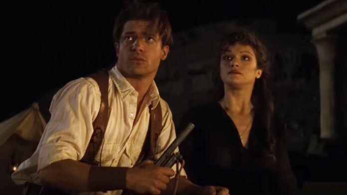 Brendan Fraser and Rachel Weisz look ominously to the night sky in The Mummy.